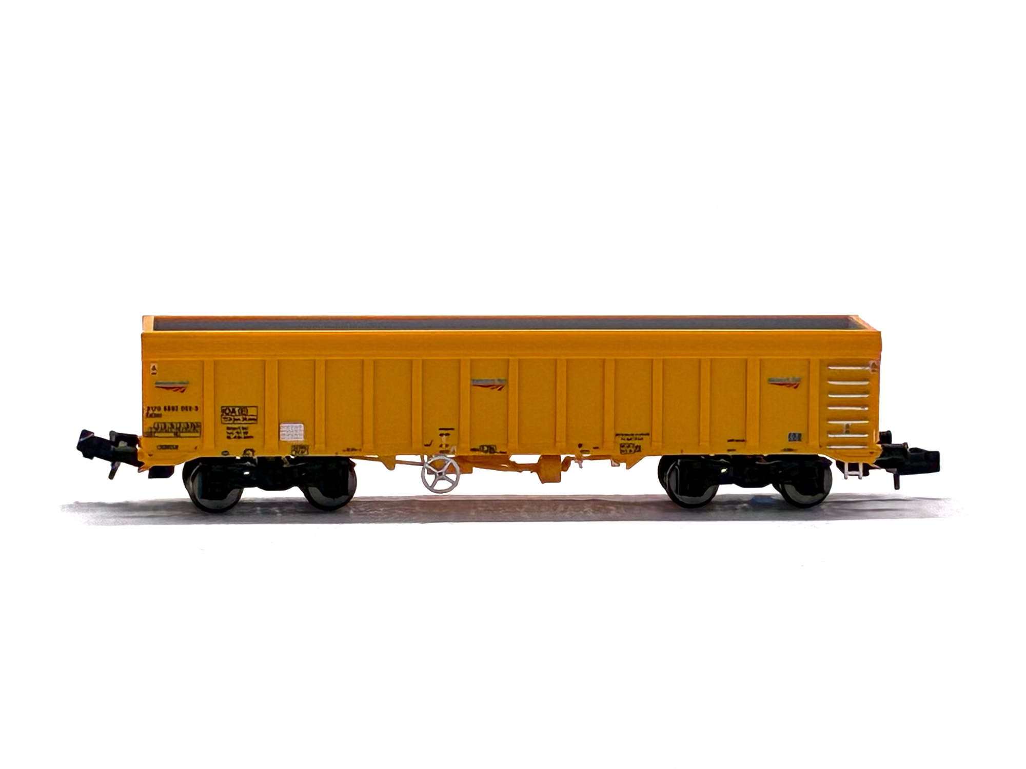 Dapol 2F-045-002 IOA 'Merlin' bogie ballast wagon in Network Rail yellow