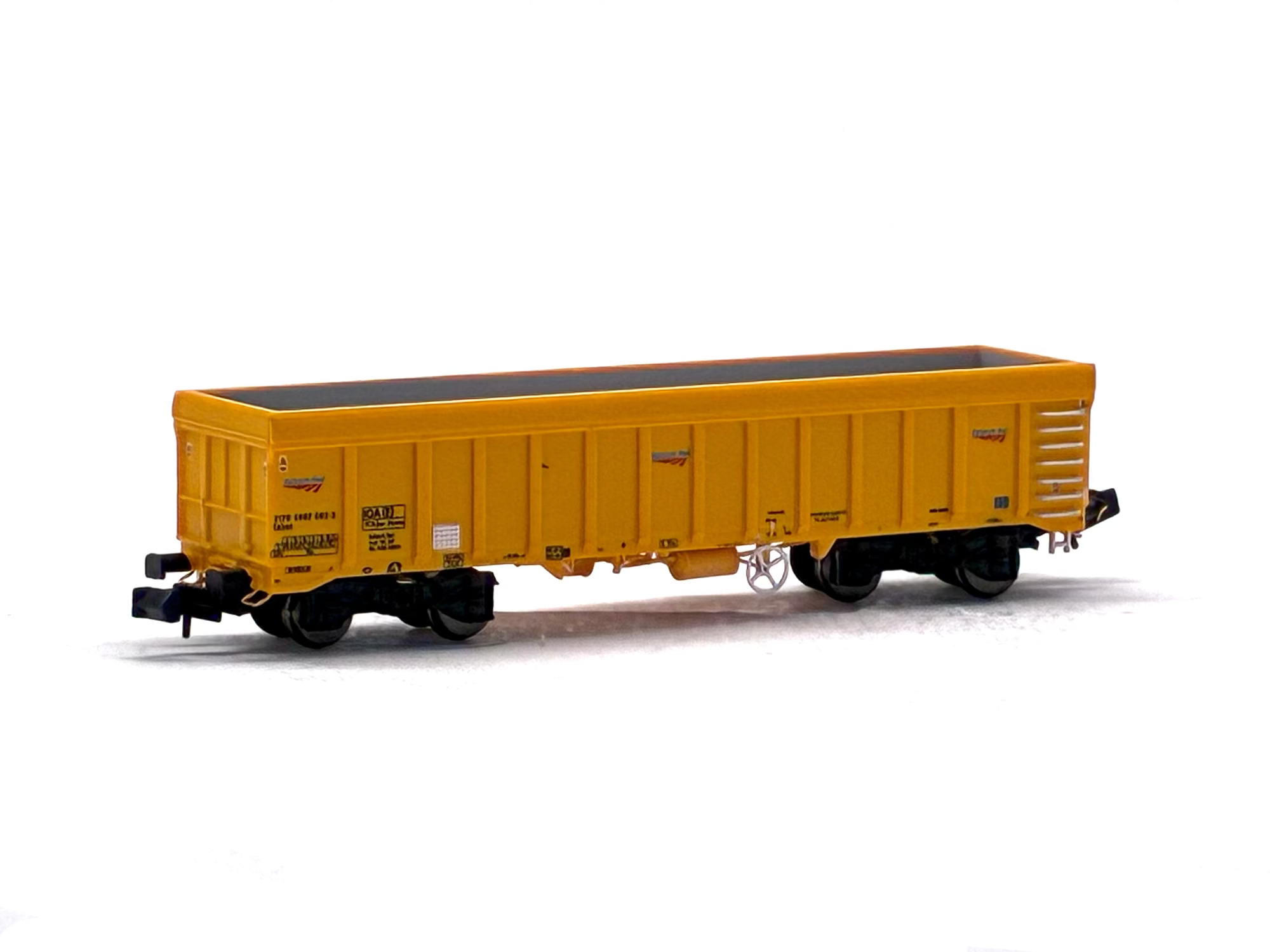 Dapol 2F-045-002 IOA 'Merlin' bogie ballast wagon in Network Rail yellow