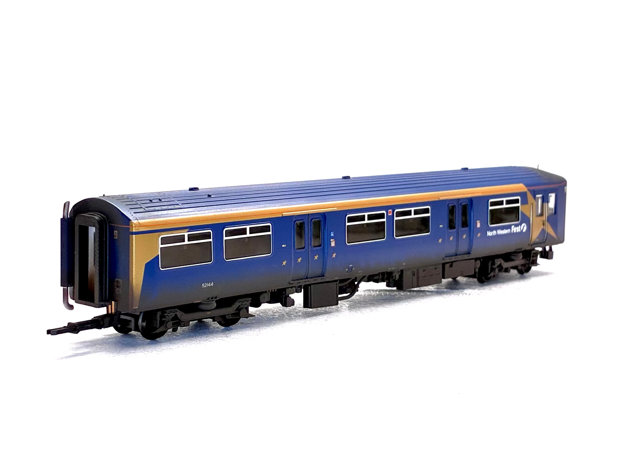 A detailed model of a blue and gold passenger train carriage, photographed on a clean white background.