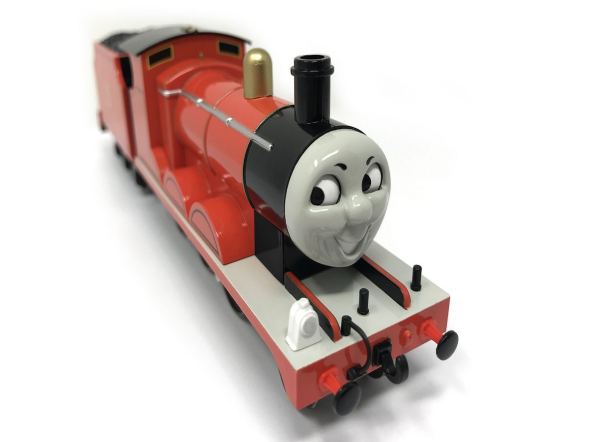 A red Thomas the Tank Engine toy train with black and cream details, shown on a white background.