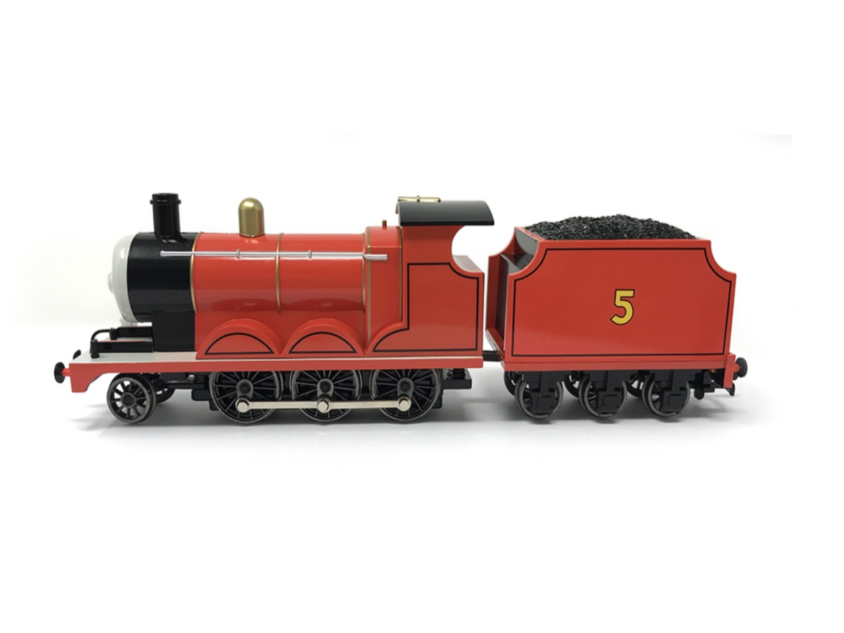 A red and black Thomas the Tank Engine toy train car, specifically James (number 5), shown from the side on a white background.