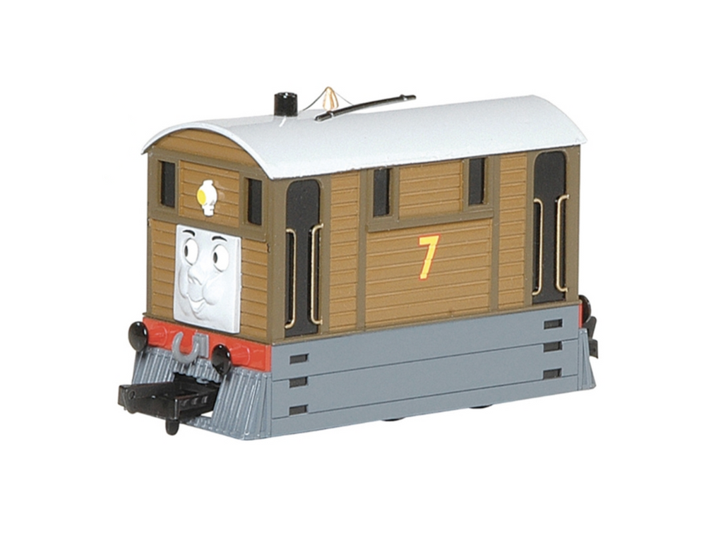 A product listing page showing a Thomas & Friends toy tram engine with moving eyes, featuring a large 3D model view, smaller thumbnail views, product details on the right, and a red 3+ age badge graphic.
