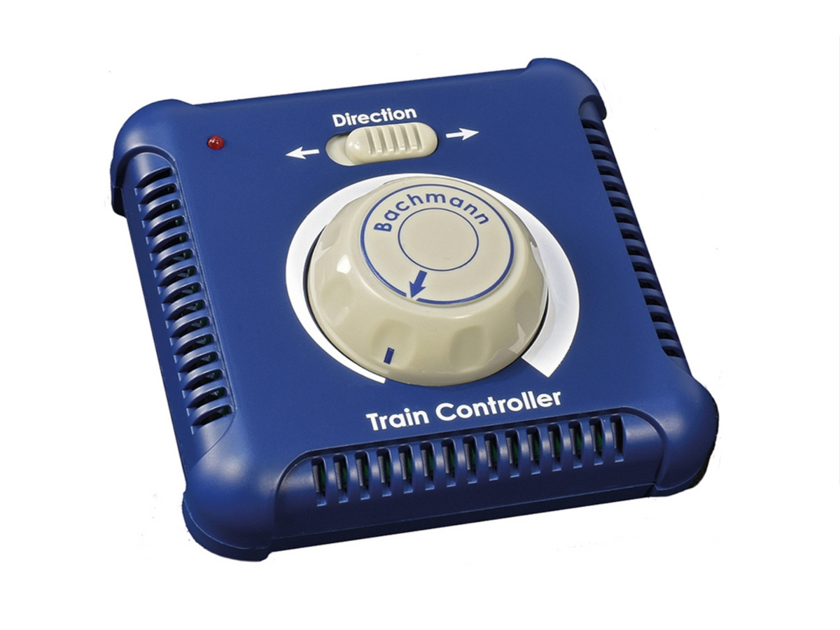 A blue and beige train controller device with a central rotary dial labeled 'Bachmann' and a directional switch labeled 'Direction', shown on a plain white background.