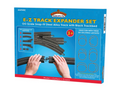 A retail box for the Bachmann E-Z Track Expander Set, showing the blue packaging with product details and photos of hands assembling black track pieces.