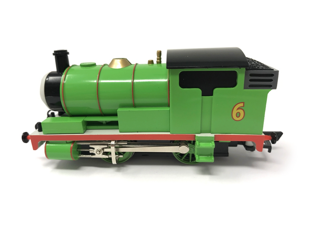 Percy green model steam locomotive with black and red details, featuring the number 6 on the side, photographed against a plain white background.
