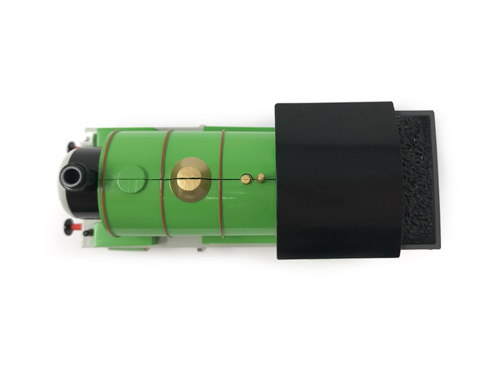 Percy green model train locomotive shown from a top down view on a white background, with a black rectangular cover partially obscuring the right side.