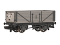 A Thomas the Tank Engine themed model Troublesome truck, featuring a gray body with a face on the front end, shown against a plain white background.