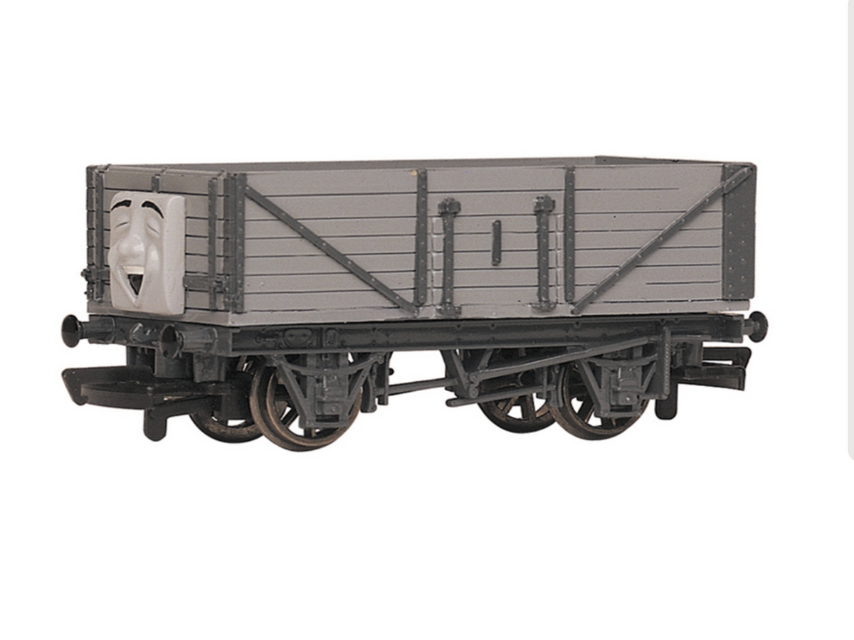 Troublesome Truck grey and black model cargo wagon with a face on the front, shown on a white background.
